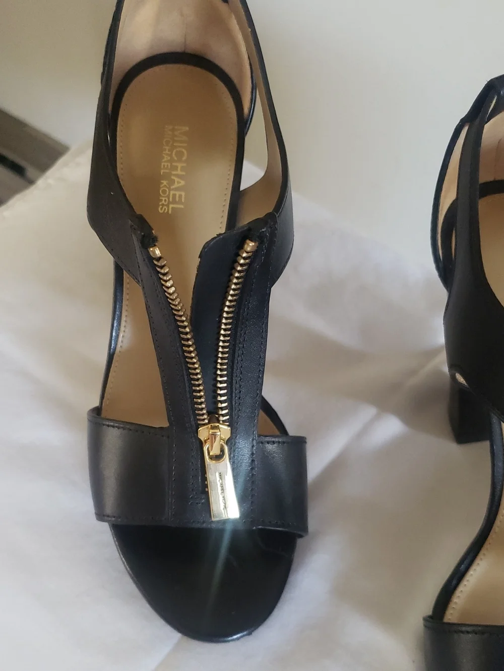 M8chael Kors Women’s Black Strappy Sandal with Gold Zip Accent